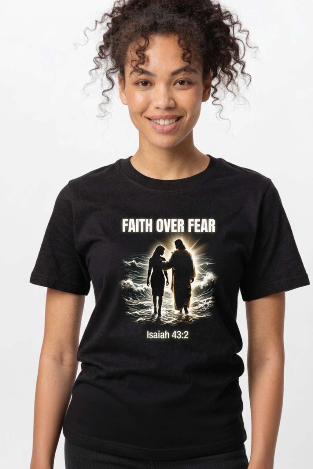 Woman wearing black Faith Over Fear t-shirt featuring Jesus walking on water with glowing light and Isaiah 43:2 Bible verse, Jamaican Christian apparel by Island Print Impression